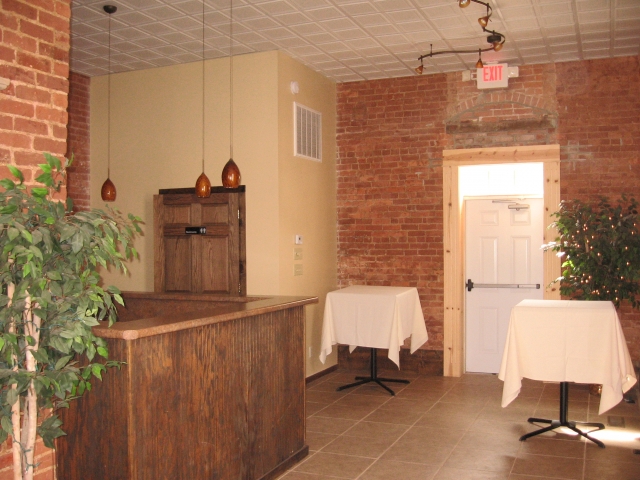 Built in bar area in the Vault room with family restroom on the left